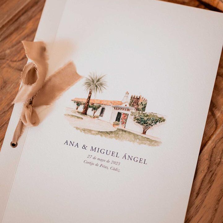 Libro de firmas para boda con portada ilustrada a mano en acuarela representando el lugar de celebración con palmeras y arquitectura