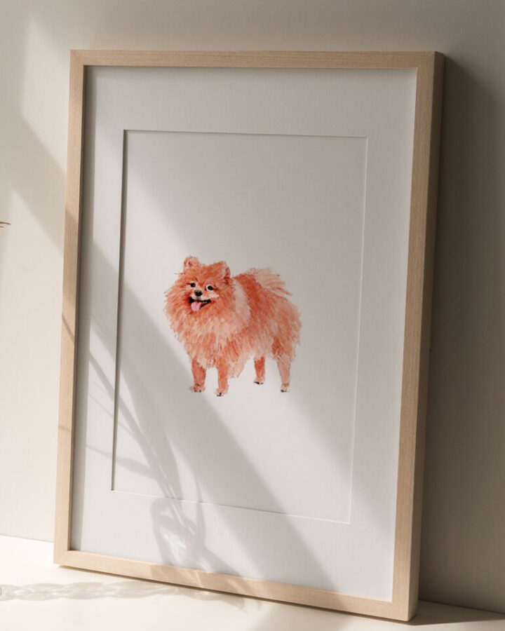 Lámina enmarcada con ilustración de un perro pomerania sonriente pintado a mano en acuarela con tonos anaranjados